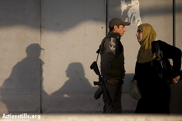 Palestinian women cross the Qalandiya checkpoint outside Ramallah, West Bank, into Jerusalem to attend the first Friday of Ramadan prayers in the Al-Aqsa Mosque, July 12, 2013. (photo: Activestills.org)