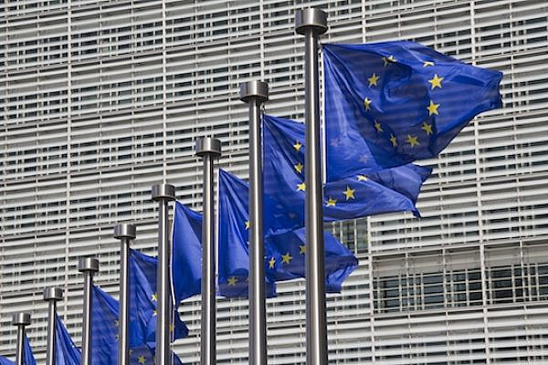 European Union flags outside the European Commission building in Brussels. (Shutterstock.com)