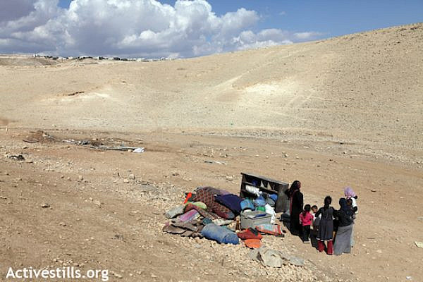 File photo of a Bedouin family after its home was demolished. (Photo: Anne Paq/Activestills.org)