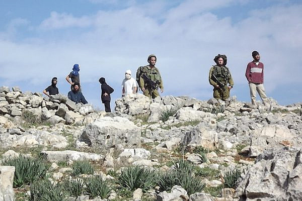 IDF stands by masked settlers in Burin (Photo: Munir Kadus, Yesh Din)