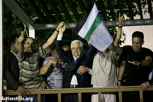 Palestinian President Mahmoud Abbas delivers a speech to released Palestinian prisoners, at his headquarters in the West Bank city of Ramallah, August 14. (Activestills.org)