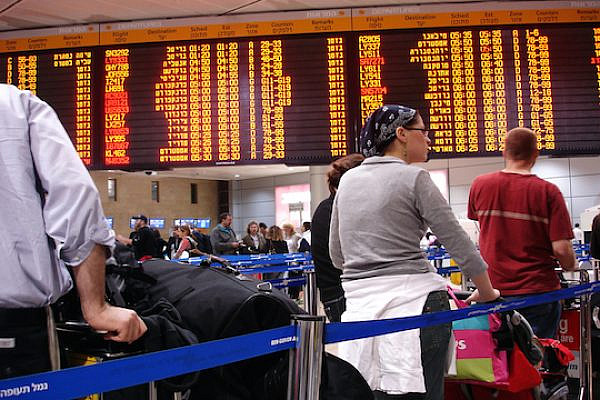 Passengers at Israel’s Ben-Gurion Airport (Photo by ChameleonsEye / Shutterstock.com)