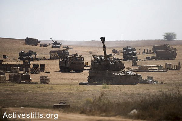 An Israeli artillery unit fire towards the Gaza Strip from their position on Israel-Gaza border, on July 21, 2014.<span class="s1"> Israeli attacks have killed 550 Palestinians in the current offensive, most of them civilians. (Yotam Ronen/Activestills.org)