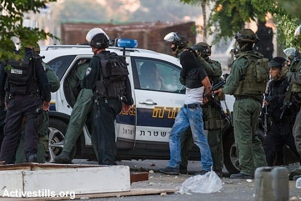 Israeli police arrest a protester during the second day of protests that followed the kidnapping and murder of a Palestinian teenager, East Jerusalem, July 3, 2014. (Photo by Faiz Abu Rmeleh/Activestills.org)