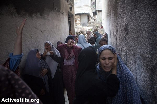 Palestinian women cry after Israeli air strike on Gaza Strip. (photo: Activestills.org)