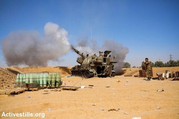 An Israeli artillery fires a shell towards the Gaza Strip from a position near Israel's border with the Gaza Strip on Augost 1, 2014 after the proposed three-day truce that began at 0500 GMT collapsed amid a deadly new wave of bloodshed and the apparent capture of an Israeli soldier by Hamas (photo: Activestills)