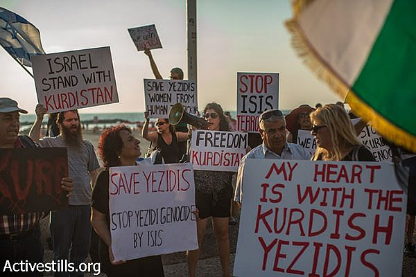 Israelis of Kurdish origin demonstrate in solidarity with the Yazidi community in front of the American Embassy in Tel Aviv, August 13, 2014. The Yazidi community in northern Iraq has recently been attacked by extremists of Islamic State. The protesters called for U.S intervention. (Yotam Ronen/Activestills.org)