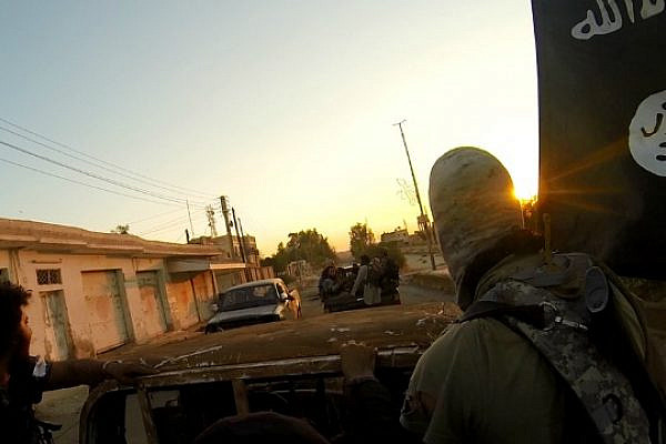 ISIS fighters ride through the Syrian city of Al-Raqqa. (photo: Islamic State)