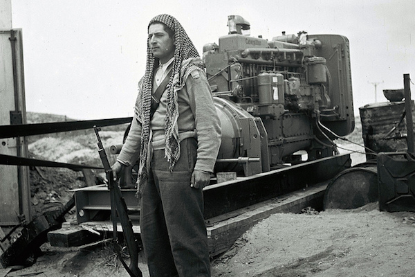 A Druze soldier in the IDF guards a mobile power station, May 13, 1949. (Photo by GPO/Zultan Kluger)