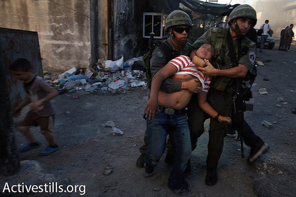 Israeli border police arrest a Palestinian youth in East Jerusalem’s Shuafat Refugee Camp, file photo. (Photo by Tess Scheflan/Activestills.org)