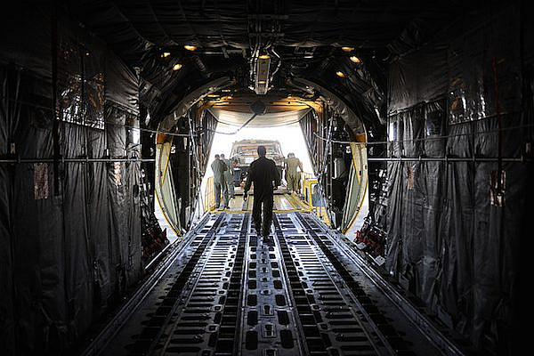 Israeli soldiers unload supplies from a C-130 cargo aircraft. (Photo: IDF Spokesperson)