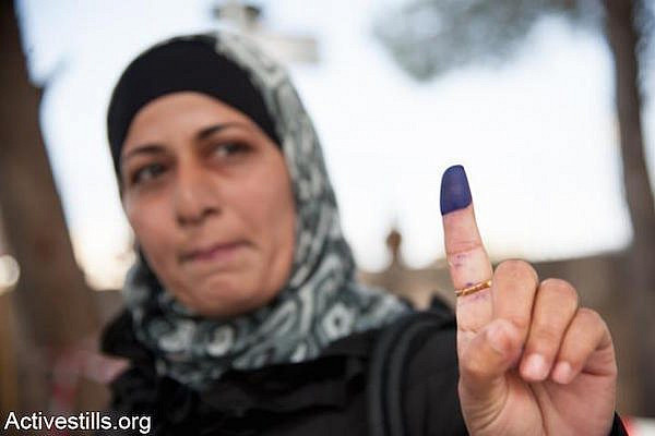File photo of a Palestinian woman voting in Bethlehem. (Photo by Activestills.org)