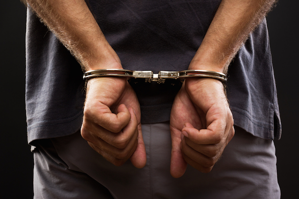 Illustrative photo of a man being arrested. (Shutterstock.com)