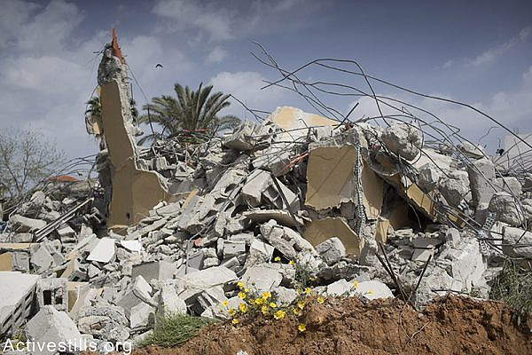 The rubble of three houses of the Assaf family hours after they were demolished by the Israeli authorities, on April 15, 2015. Dahmash is the only unrecognised village in the center of Israel of Palestinians and Bedouins, located between Lod and Ramle. Oren Ziv / Activestills.org