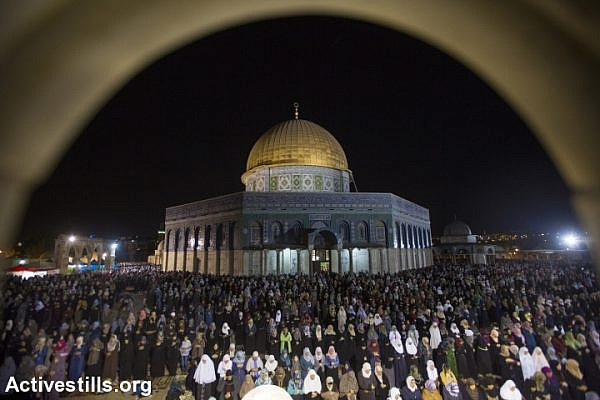Palestinian Muslim worshippers pray overnight, July 13, 2015 outside the Dome of the Rock in the Al-Aqsa mosque compound in Jerusalem's Old City during Laylat al-Qadr which falls on the 27th day of the fasting month of Ramadan, July 13, 2015. (photo: Faiz Abu Rmeleh/Activestills.org)