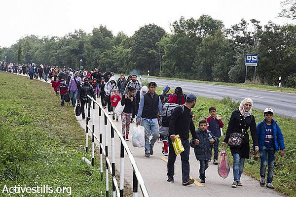 Refugees march toward the Hungarian-Austrian border. (Keren Manor/Activestills.org)