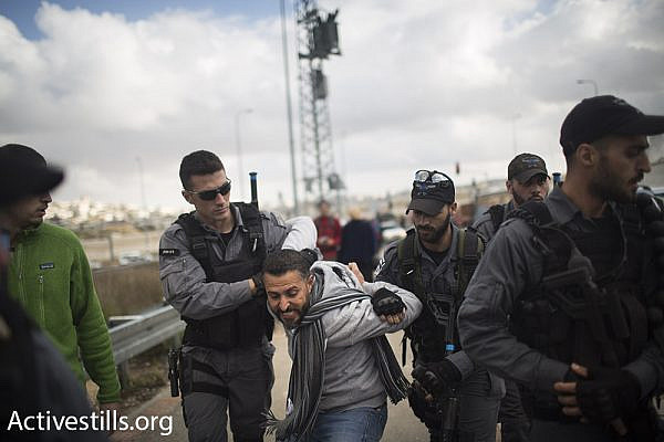 Israeli police arrest a Palestinian organizer of the protest, a member of Combatants for Peace, Beit Jala, West Bank, January 15, 2016. (Oren Ziv/Activestills.org)