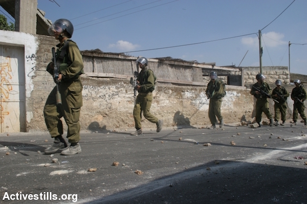 Illustrative photo of Israeli soldiers inside a Palestinian village. (Oren Ziv/Activestills.org)