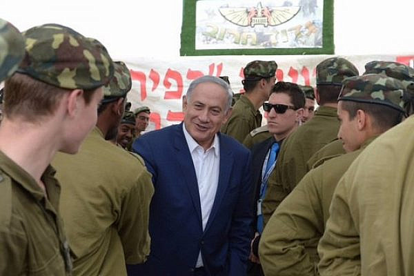Prime Minister Netanyahu meets soldiers from the Kfir Brigade on the Jewish holiday of Purim. (photo: Amos Ben Gershon/GPO)
