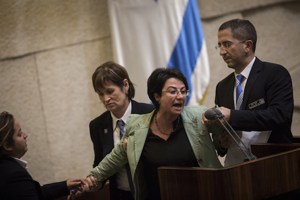 Haneen Zoabi is removed by Knesset security on February 8, 2016. (Hadas Parush/Flash90)