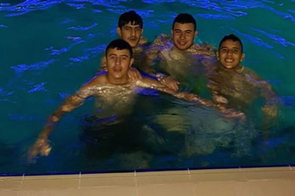 The final photo. Mahmoud Badran (first on the right) and his friends, who went for an evening swim at the pool and finished off the night riddled with bullets. (Photo courtesy of B'Tselem)