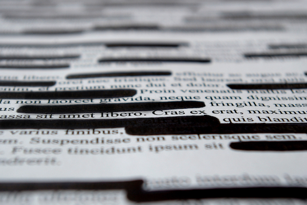 A redacted document (Illustrative photo by Shutterstock.com)