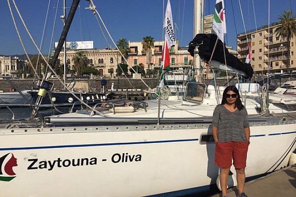 +972 blogger Orly Noy stands alongside the 'Zaytouna,' which sailed to Gaza as part of an all-women aid flotilla.