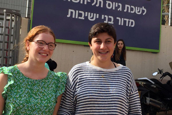 Tamar Alon and Tamar Ze’evi stand outside the IDF’s Tel Hashomer induction base where they were expected to declare their refusal to serve in the army, and be sentenced to prison, Tel Aviv, November 16, 2016. (Haggai Matar)
