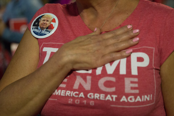A woman holds her hand to her heart at a Donald Trump campaign event in Berwyn, Pennsylvania, November 3, 2016. (Noam Revkin FentonFlash90)