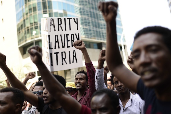 Eritrean asylum seekers protest in front of the European Union embassy in Ramat Gan, near Tel Aviv, calling for the EU to try the Eritrean leadership for crimes against humanity, on June 21, 2016. (Tomer Neuberg/Flash90)