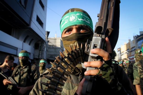 Palestinian members of the al-Qassam Brigades, the armed wing of the Hamas movement, take part in military parade marking the second anniversary of the killing of Hamas's military commanders, Mohammed Abu Shamala and Raed al-Attar, August 21, 2016 in Rafah in the southern Gaza Strip. (Abed Rahim Khatib/Flash90)