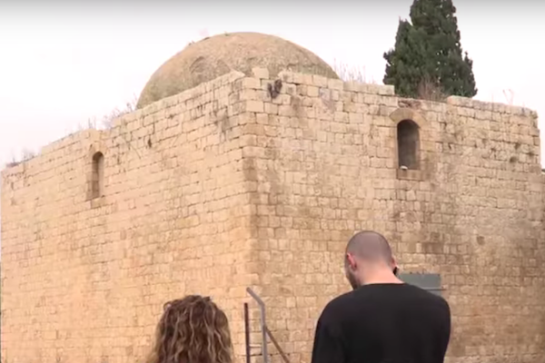 Illustrative photo of Palestinian youth in front of a Nakba ruin. (YouTube screenshot)