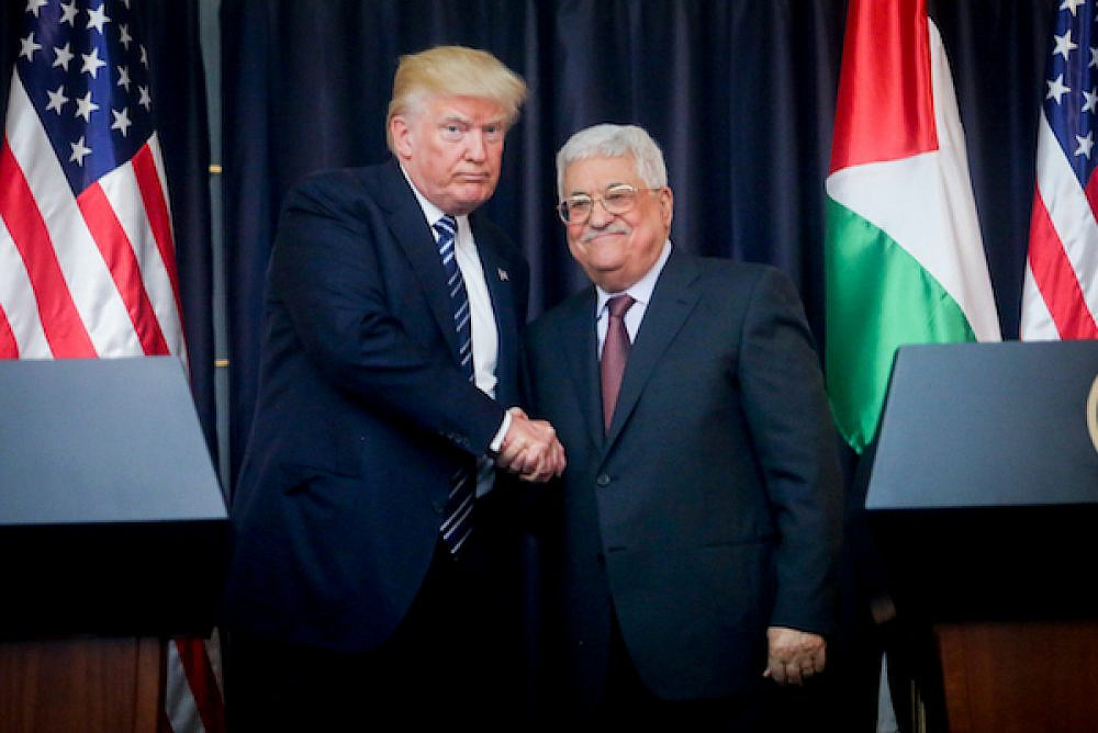 Palestinian President Mahmoud Abbas and U.S. President Donald Trump shake hands in the West Bank city of Bethlehem, May 23, 2017. (Flash90)