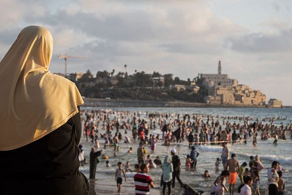 The beach in Jaffa with the Old City in the background. (Yaakov Lederman/Flash90)