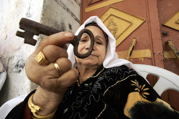 Palestinian refugee Laila Abdel Meguid Tafesh 78 years old, from the Rafah refugee camp, holds up a key she says is from her house in Jaffa. (Abed Rahim Khatib / Flash90)