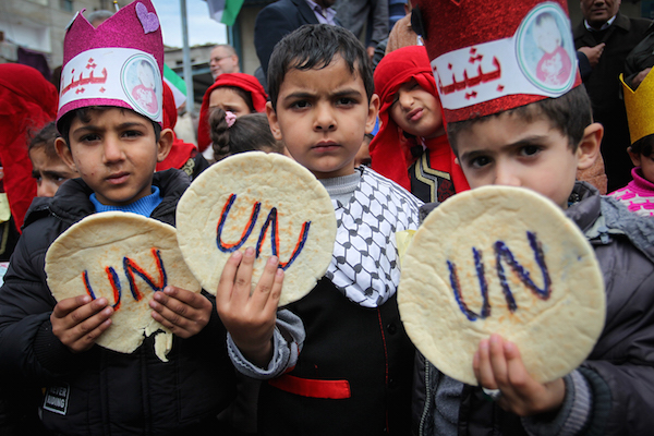 Palestinians take part in a protest against aid cuts, outside the United Nations' offices in Khan Younis in the southern Gaza Strip, January 28, 2018. (Abed Rahim Khatib/ Flash90)