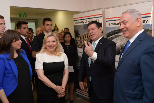 Prime Minister Benjamin Netanyahu (right) his wife Sara (left) and Paraguayan President Horacio Cartes (center) seen at the official opening ceremony of the Paraguay embassy in Jerusalem on May 21, 2018. (Amos Ben Gershom/GPO)