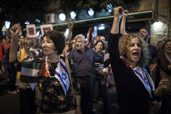 Palestinian and Israeli peace activists march in central Jerusalem on October 17, 2015. (Hadas Parush/Flash90)