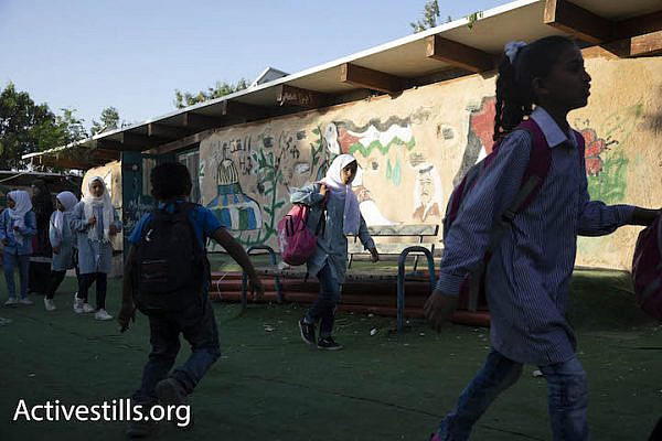 Palestinian schoolchildren begin their day at the Khan al-Ahmar eco-school, October 14, 2018. (Oren Ziv/Activestills.org)