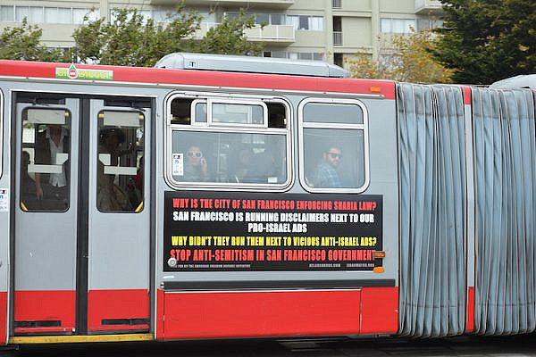 File photo of an advertisement on a San Francisco public bus accusing the city of enforcing Sharia law, paid for by the American Freedom Defense Initiative, which received funding from the SF Jewish Federation. (Steve Rhodes/CC 2.0)