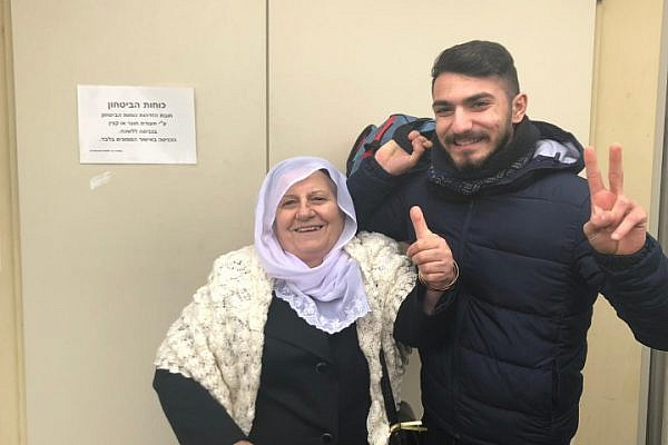 Kamal Zidan and his grandmother pose for a photo before he presented himself at the Israeli army induction base. (Courtesy of the Zidan family)