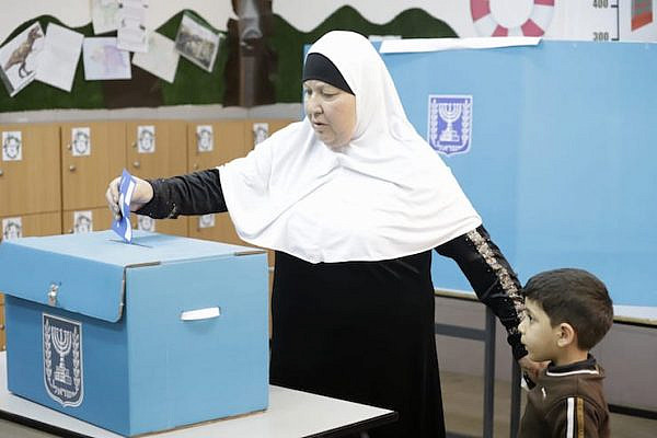 A Palestinian citizen of Israel casts her vote in the 2019 election, Taybeh, central Israel, April 9, 2019. (Oren Ziv/Activestills.org)