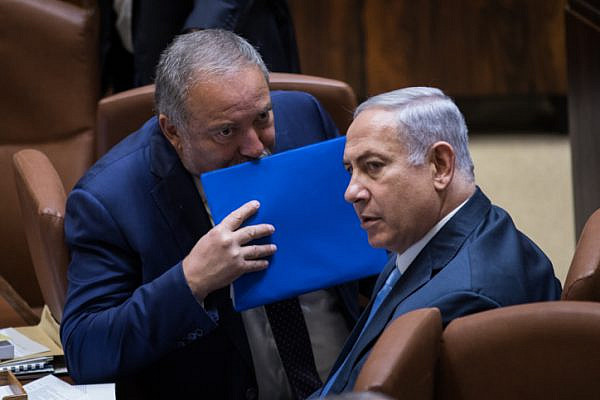 Avigdor Liberman and Prime Minister Benjamin Netanyahu seen at the opening winter session of the Knesset, October 23, 2017. (Hadas Parush/Flash90)