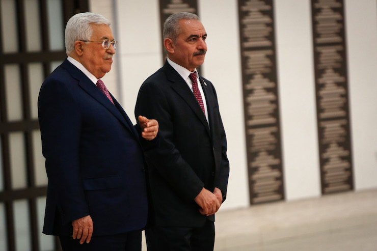 Palestinian Prime Minister Mohammad Shtayyeh (R) and President Mahmoud Abbas (L) at the swearing in ceremony of the new government at the Palestinian Authority&#8217;s headquarters in Ramallah, April 13, 2019. (Nasser Ishtayeh/Flash90)