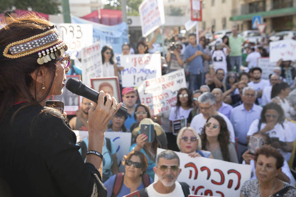 A family member of a child who disappeared during the early years of the state speaks during a rally commemorating the Yemenite Children Affair Jerusalem, July 31, 2019. (Oren Ziv/Activestills.org)