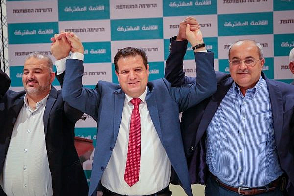 Mansour Abbas, Ayman Odeh, and Ahmad Tibi (left to right) join hands at the announcement of the return of the Joint List. (Photo courtesy of the Joint List)