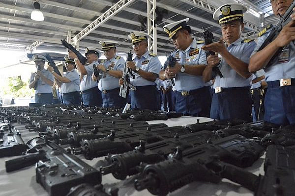 The Philippine Coast Guard presenting a shipment of 70 Israeli-made machine guns at the PCG National Headquarters Port Area on May 7, 2018. (Philippines Coast Guard)