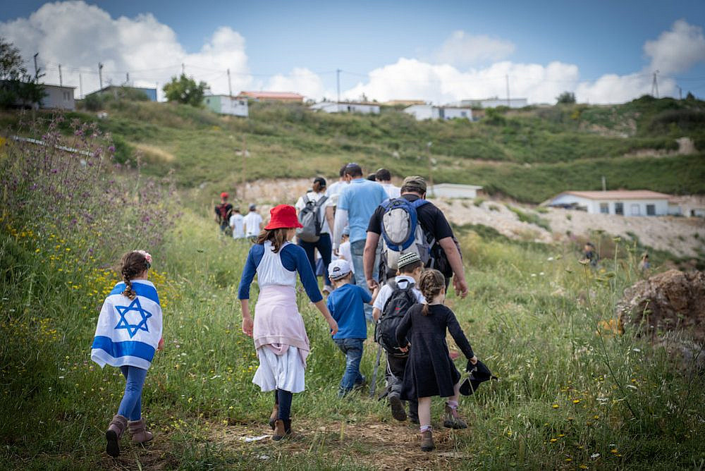 Israeli settlers seen celebrating Israeli Independence Day near the outpost of Havat Gilad, West Bank, May 9, 2019. (Hillel Maeir/Flash90)