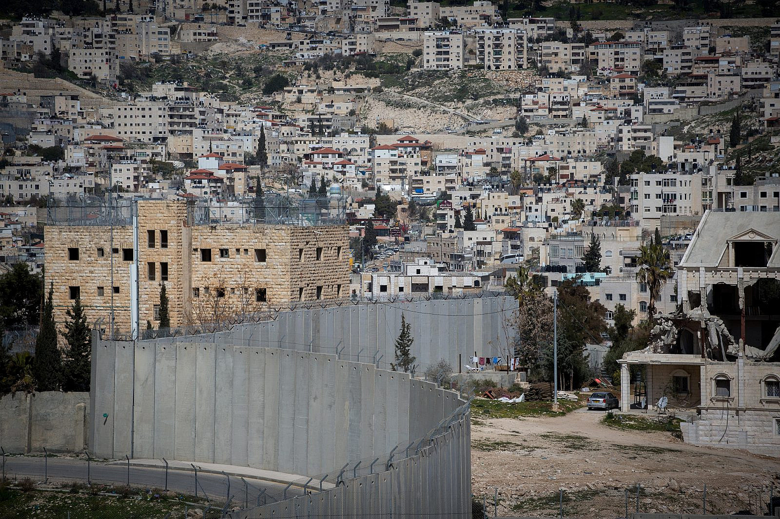 View of the separation wall as seen from the Palestinian town of Abu Dis. February 26, 2017. (Miriam Alster/FLASH90)