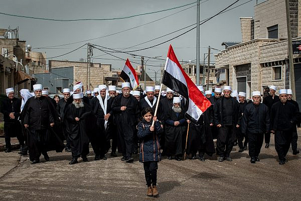 Members of the Syrian Druze community protest against U.S. President Donald Trump's recognition of Israeli sovereignty in the Golan Heights, in Buq'ata, Golan Heights, March 30, 2019. (Basel Awidat/Flash90)